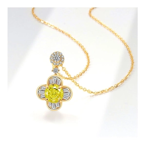 Collana a fiore in oro 18 carati con gemma gialla centrale e dettagli di diamanti