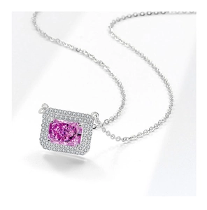 Macro shot of Radiant-cut pink gem necklace with silver double-halo diamond pavé