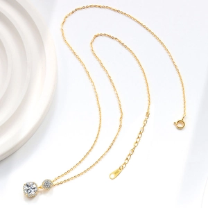 S925 sterling silver gold plated necklace with double cubic zirconia pendant on white tray