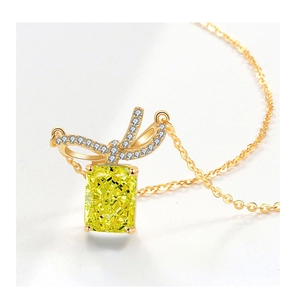 Detailed close-up of S925 silver necklace with radiant cut yellow gemstone pendant