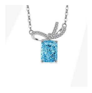 Detail view of S925 silver bow necklace with rectangle blue stone and white zircon stones