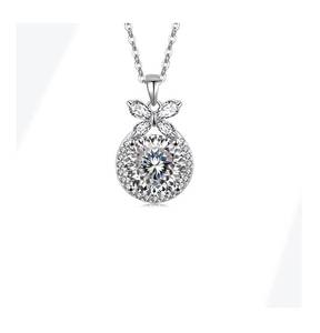 Macro shot of S925 silver necklace pendant with ice cut floral crystal and butterfly detail