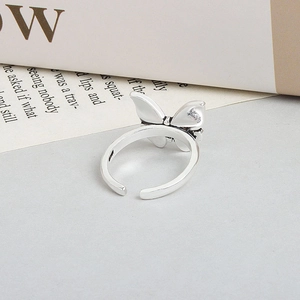 Elegant silver butterfly open ring with adjustable band on a minimalist aesthetic background