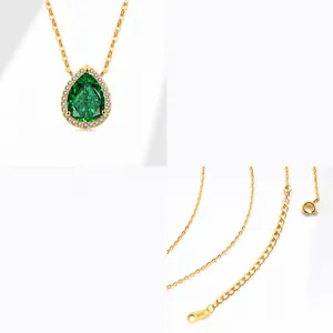 Macro detail of S925 sterling silver pear cut green zircon pendant with gold plated chain