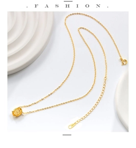 Macro view of S925 sterling silver gold necklace with yellow oval cut gemstone and clasp
