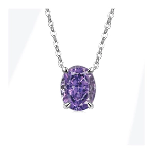 Close-up of elegant silver necklace featuring an oval purple gemstone in 4-prong setting