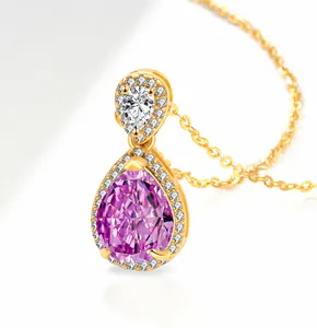 Detail of pear-cut pink gemstone pendant with halo diamonds in gold setting