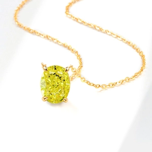 Elegant gold necklace featuring an oval-cut yellow gemstone in a classic 4-prong setting