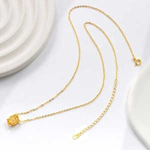 Minimalist gold S925 sterling silver necklace with oval yellow gemstone pendant in top view