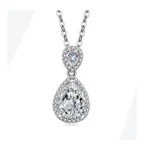 Detail showing the double pear-shaped halo pendant with silver chain and transparent gems