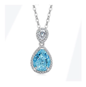 Detail of light blue pear-cut gemstone pendant with halo diamonds on silver chain