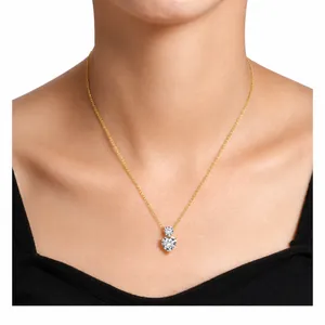 Macro shot of gold heart pendant necklace with round and heart-cut white crystals