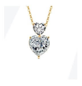 Close-up of double heart crystal pendant necklace with elegant gold chain