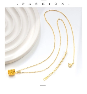 Detailed close-up of S925 sterling silver gold necklace with yellow gemstone and extension chain
