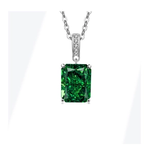 Detailed macro view of rectangular green gemstone necklace with brilliant diamond halo