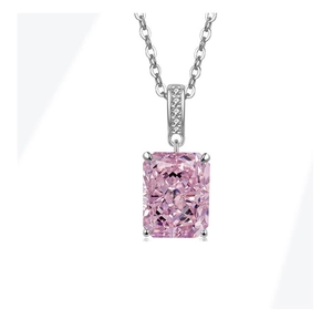 Macro shot of rectangular pink gemstone necklace with silver claw setting and o-chain