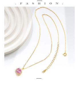 Macro detail of S925 sterling silver stamp on golden pink gemstone halo pendant necklace