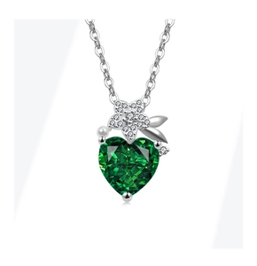 Detail of silver floral pendant with heart emerald zircon and small pearl accent