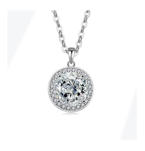 Detailed view of silver halo pendant necklace with large center stone and pavé accents
