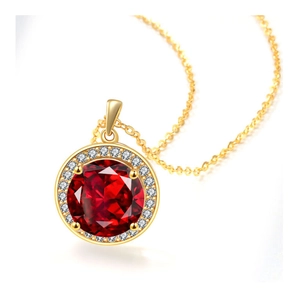 Close-up of luxury halo necklace with large round red gemstone and gold chain