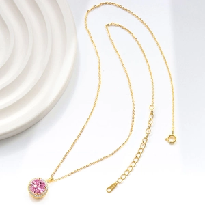 Elegant gold S925 silver necklace with a round pink gemstone pendant and halo diamonds