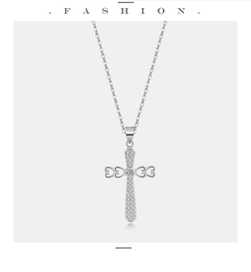 Close-up of S925 sterling silver cross necklace with heart detail and pave-set zircons