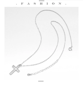 Macro shot of S925 sterling silver cross pendant with fine O-chain and hallmark tag