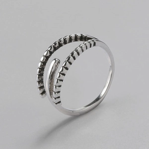 Detailed macro view of S925 sterling silver layered ring with vintage textured finish