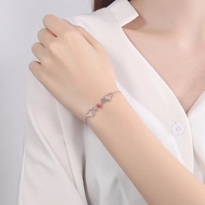 Minimalist S925 silver bracelet with red heart pendant and heart gesture charm links