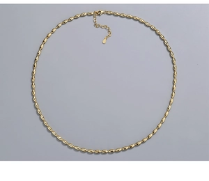 Detailed close-up of S925 sterling silver golden beaded chain with lobster clasp and tag