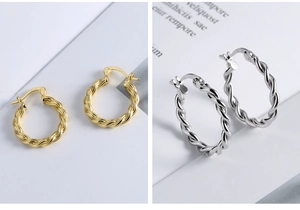 Detailed view of 925 silver twist hoop earrings in gold and silver polished finishes