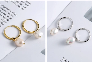 Detailed macro view of S925 silver hoop earrings with baroque freshwater pearls