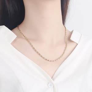 Elegant gold oval bean link necklace for women shown on neck with white shirt