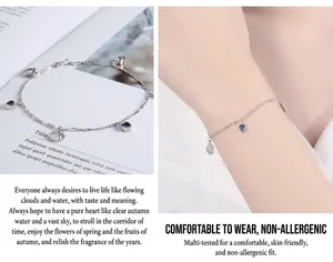 Detalle de pulsera S925 de plata con corazón, gemas azules y dije de concha en la muñeca