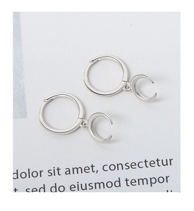 Detail view of a 925 sterling silver hoop earring with a polished crescent moon pendant