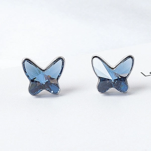 Exquisite sterling silver butterfly stud earrings with faceted blue Austrian crystal