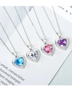 Detail view of heart-shaped gemstone necklaces in blue, white, pink, and purple colors