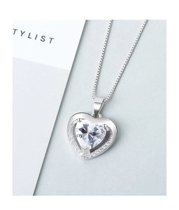 Detailed close-up of a S925 sterling silver heart-shaped necklace with halo zircons