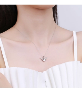 Detailed view of moissanite deer antler pendant on an S925 sterling silver chain