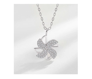 Detailed view of 925 silver rotating windmill pendant with sparkling zircon inlay