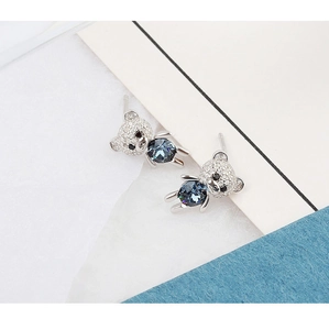 Detail of 925 silver teddy bear earrings with blue crystals and white zircons