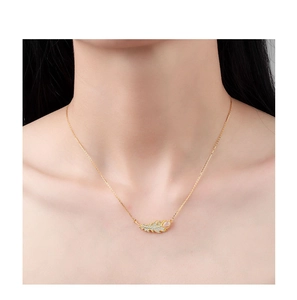 Detail of s925 silver leaf pendant necklace with micro-set zircon and pink gemstone