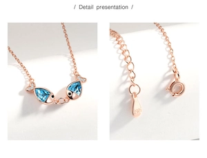 Detail presentation of S925 sterling silver kiss fish necklace with blue crystal pendant