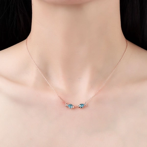 Elegant S925 sterling silver necklace featuring crystal kissing fish pendant on model