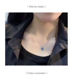 Wearing display of the Heart of the Ocean necklace with blue heart crystal pendant