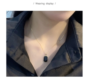 Wearing display of S925 silver vintage square pendant necklace with gold chain on model