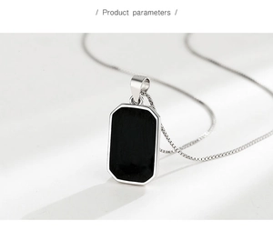 Macro shot of S925 sterling silver square pendant with black enamel inlay and box chain