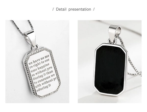 Detail of S925 sterling silver square pendant with engraved quote and black enamel back