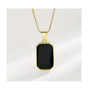 Close-up of a gold S925 sterling silver square pendant featuring a black enamel center