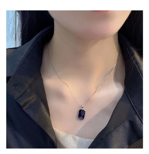 Detailed view of an S925 silver necklace featuring a rectangular dark gemstone pendant